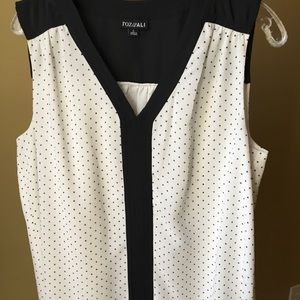 Large White and black Polk a dot sleeveless blouse